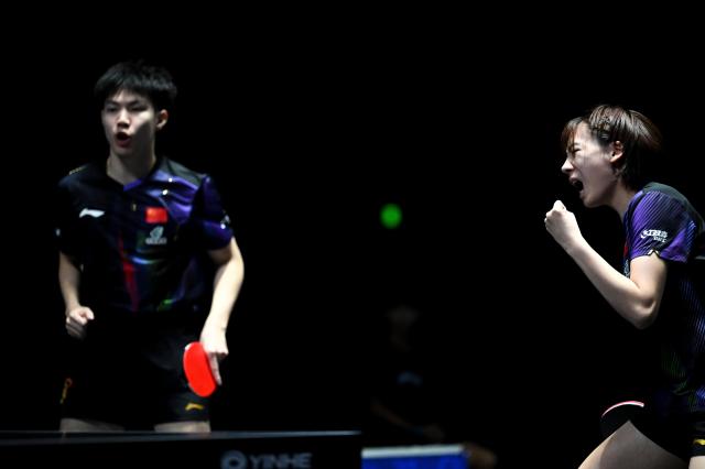 (261024) -- TASHKENT, Oct. 24, 2026 (Xinhua) -- Huang Youzheng/Chen Yi (R) of China react during the mixed doubles final against Matsushima Sora/Harimoto Miwa of Japan at the 29th ITTF-Asian Table Tennis Championships in Tashkent, Uzbekistan, Oct. 23, 2026. (Xinhua/Feng Kaihua)