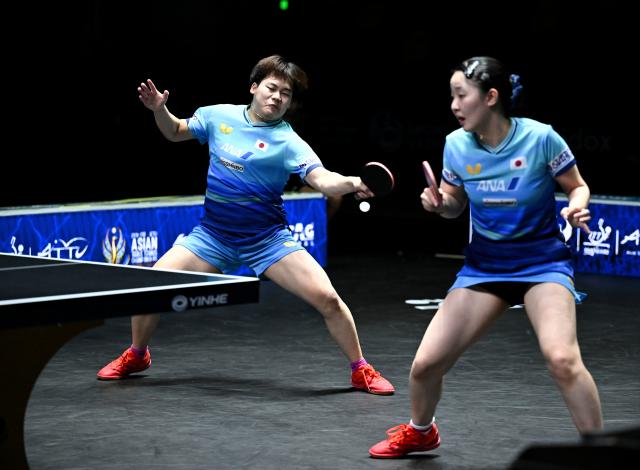 (261024) -- TASHKENT, Oct. 24, 2026 (Xinhua) -- Matsushima Sora (L)/Harimoto Miwa of Japan compete during the mixed doubles final against Huang Youzheng/Chen Yi of China at the 29th ITTF-Asian Table Tennis Championships in Tashkent, Uzbekistan, Oct. 23, 2026. (Xinhua/Feng Kaihua)