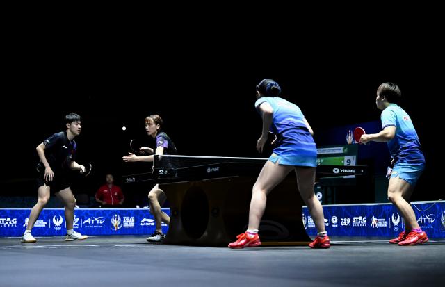(261024) -- TASHKENT, Oct. 24, 2026 (Xinhua) -- Huang Youzheng (1st L)/Chen Yi (2nd L) of China compete during the mixed doubles final against Matsushima Sora/Harimoto Miwa of Japan at the 29th ITTF-Asian Table Tennis Championships in Tashkent, Uzbekistan, Oct. 23, 2026. (Xinhua/Feng Kaihua)