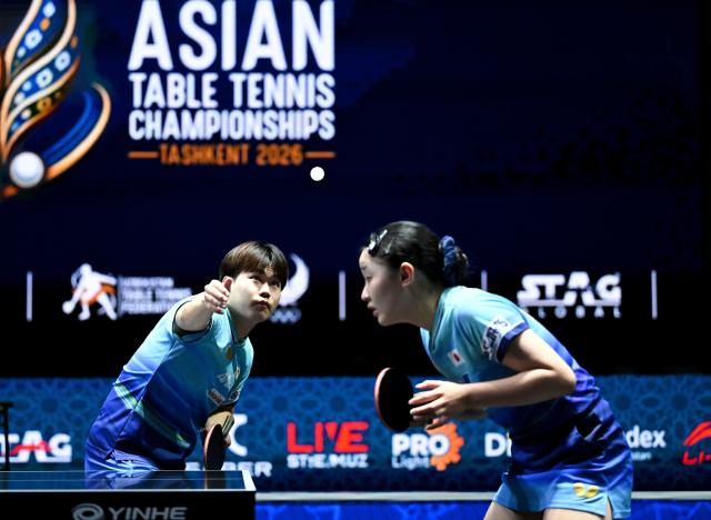 (261024) -- TASHKENT, Oct. 24, 2026 (Xinhua) -- Matsushima Sora (L)/Harimoto Miwa of Japan compete during the mixed doubles final against Huang Youzheng/Chen Yi of China at the 29th ITTF-Asian Table Tennis Championships in Tashkent, Uzbekistan, Oct. 23, 2026. (Xinhua/Feng Kaihua)