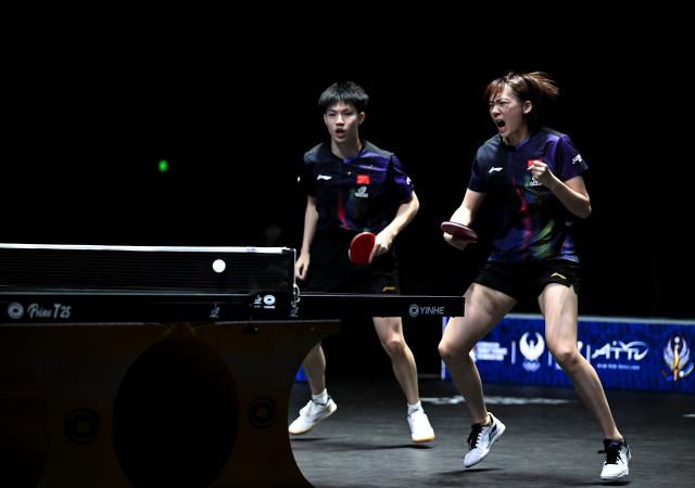 (261024) -- TASHKENT, Oct. 24, 2026 (Xinhua) -- Huang Youzheng/Chen Yi (R) of China react during the mixed doubles final against Matsushima Sora/Harimoto Miwa of Japan at the 29th ITTF-Asian Table Tennis Championships in Tashkent, Uzbekistan, Oct. 23, 2026. (Xinhua/Feng Kaihua)