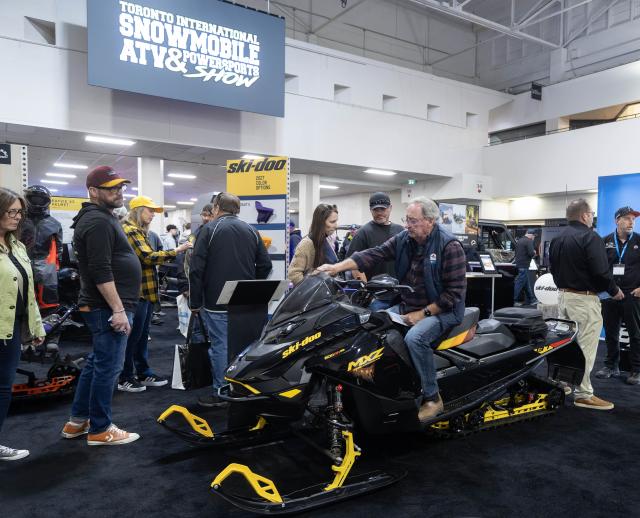 (261024) -- MISSISSAUGA, Oct. 24, 2026 (Xinhua) -- A man tries a Ski-Doo snowmobile at the 2026 Toronto International Snowmobile, ATV & Powersports Show in Mississauga, Canada, on Oct. 23, 2026. Showcasing hundreds of snowmobiles and powersports vehicles from major manufacturers worldwide, the annual event runs here from Friday to Sunday. (Photo by Zou Zheng/Xinhua)