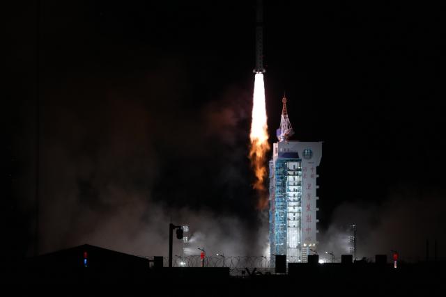 (261024) -- JIUQUAN, Oct. 24, 2026 (Xinhua) -- A Long March-4B carrier rocket carrying two groups of remote sensing satellites blasts off from the Jiuquan Satellite Launch Center in northwest China, Oct. 24, 2026. The satellites 07-09 of the Yaogan-53 group and the satellites 19-21 of the Yaogan-56 group were launched at 3:25 a.m. (Beijing Time) aboard a Long March-4B carrier rocket, and they entered the preset orbits successfully. (Photo by Wang Jiangbo/Xinhua)