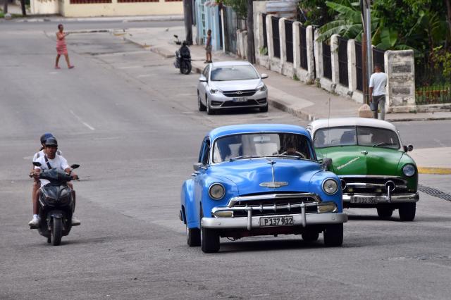 (261024) -- HAVANA, Oct. 24, 2026 (Xinhua) -- Two vintage cars run on a street in Havana, Cuba, Oct. 23, 2026.
  Cuban Foreign Minister Bruno Rodriguez Friday denounced a new threat of military intervention against the Caribbean nation by U.S. President Donald Trump.
  In a post on X, Rodriguez rejected "any threat regarding U.S. ambitions toward Cuba" in response to remarks by Trump, who said Friday that U.S. ships "will pass" Cuba on their way back from Iran. (Photo by Joaquin Hernandez/Xinhua)