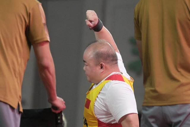 (261024) -- NAGOYA, Oct. 24, 2026 (Xinhua) -- Zou Yi of China reacts during the mixed team bronze medal match between China and Uzbekistan of Para Powerlifting at the Aichi-Nagoya Asian Para Games in Nagoya, Japan, Oct. 24, 2026. (Xinhua/Then Chih Wey)