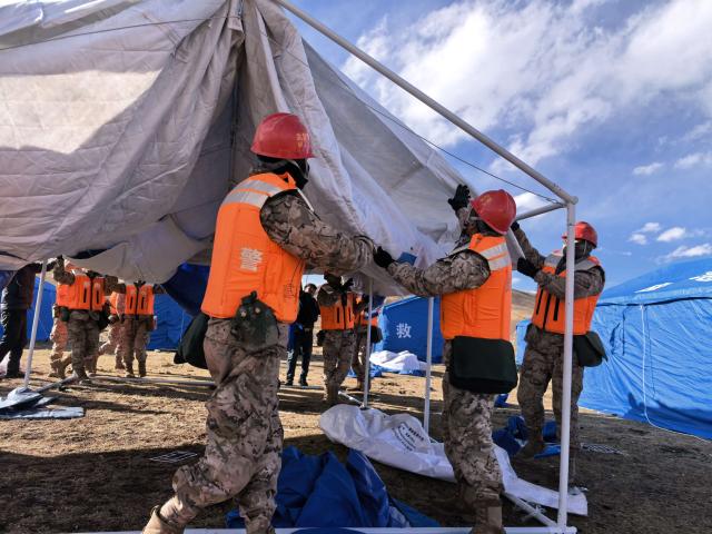(261024) -- NAGQU, Oct. 24, 2026 (Xinhua) -- Members of the People's Armed Police Force Xizang Corps set up a temporary tent at a quake-hit village in Maru Township of Baqen County, Nagqu City, southwest China's Xizang Autonomous Region, Oct. 23, 2026.
  Sixteen people have been killed and 76 others are injured following a 7.0-magnitude earthquake that struck Baqen County of the city of Nagqu in southwest China's Xizang Autonomous Region at 10:33 p.m. on Thursday, local authorities said. (Photo by Wang Xingquan/Xinhua)