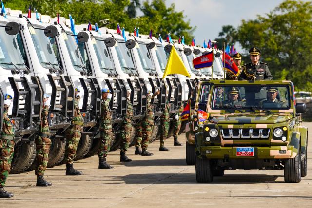 (261024) -- PHNOM PENH, Oct. 24, 2026 (Xinhua) -- Cambodian Prime Minister Hun Manet standing in the front jeep inspects troops during a ceremony marking the 20th anniversary of Cambodia's participation in United Nations (UN) peacekeeping operations in Kampong Speu province, Cambodia, Oct. 24, 2026.
  Cambodia on Saturday celebrated the 20th anniversary of its participation in UN peacekeeping operations, vowing to expand its role in maintaining regional and global stability, security, and development. (Photo by Nitola/Xinhua)