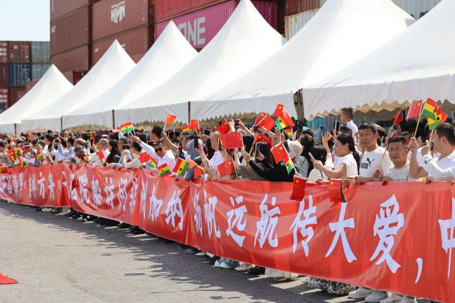 (261024) -- TEMA, Oct. 24, 2026 (Xinhua) -- Representatives of the Chinese community and Chinese enterprises in Ghana welcome the arrival of the Chinese People's Liberation Army Navy hospital ship Auspicious Ark in Tema, Ghana, Oct. 23, 2026.
  The Chinese People's Liberation Army Navy hospital ship Auspicious Ark arrived in Ghana's eastern port of Tema on Friday for a friendly visit and medical mission, marking the first visit by a Chinese naval hospital ship to the West African country.
  The hospital ship, which is carrying out Mission Harmony-2026, docked at the port at around 10:00 a.m. local time (1000 GMT). (Xinhua/Gao Jianfei)