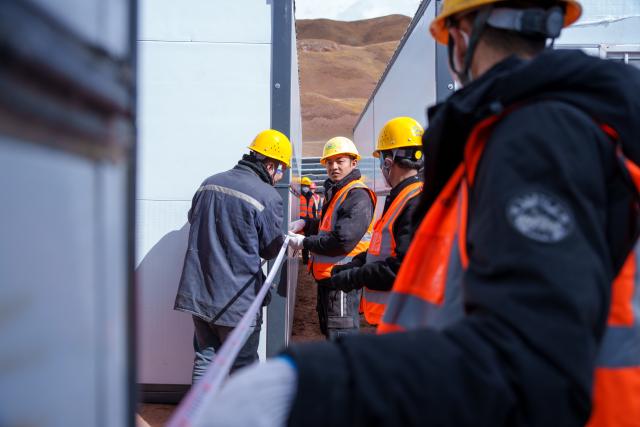 (261024) -- NAGQU, Oct. 24, 2026 (Xinhua) -- Workers of China Railway Group Limited build prefabricated houses at a quake-hit village in Maru Township of Baqen County, Nagqu City, southwest China's Xizang Autonomous Region, Oct. 24, 2026.
  The first batch of prefabricated houses has been set up on Saturday for the affected residents in a village of Maru Township, one of the hardest-hit areas near the epicenter, following a 7.0-magnitude earthquake that struck Baqen County of the city of Nagqu in southwest China's Xizang Autonomous Region at 10:33 p.m. on Thursday. (Xinhua/Tenzin Nyida)