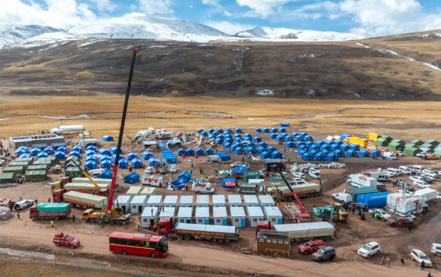 (261024) -- NAGQU, Oct. 24, 2026 (Xinhua) -- An aerial drone photo taken on Oct. 24, 2026 shows workers of China Railway Group Limited building prefabricated houses at a quake-hit village in Maru Township of Baqen County, Nagqu City, southwest China's Xizang Autonomous Region.
  The first batch of prefabricated houses has been set up on Saturday for the affected residents in a village of Maru Township, one of the hardest-hit areas near the epicenter, following a 7.0-magnitude earthquake that struck Baqen County of the city of Nagqu in southwest China's Xizang Autonomous Region at 10:33 p.m. on Thursday. (Xinhua/Tenzin Nyida)