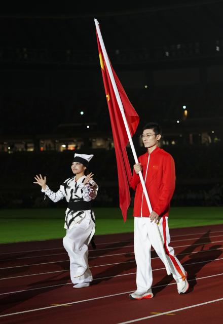 (261024) -- NAGOYA, Oct. 24, 2026 (Xinhua) -- Flag bearer of China Zhong Saichun enters the stadium during the closing ceremony of the Aichi-Nagoya Asian Para Games in Nagoya, Japan, Oct. 24, 2026. (Xinhua/Jia Haocheng)