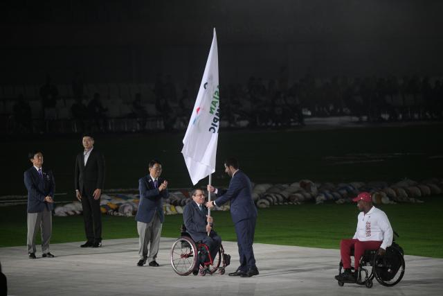 (261024) -- NAGOYA, Oct. 24, 2026 (Xinhua) -- Photo taken on Oct. 24, 2026 shows the flag handover ceremony during the closing ceremony of the Aichi-Nagoya Asian Para Games in Nagoya, Japan. (Xinhua/Then Chih Wey)