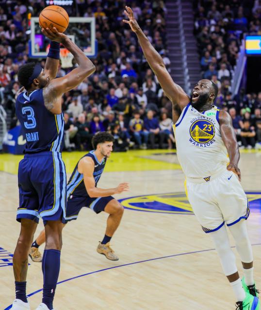 (261024) -- SAN FRANCISCO, Oct. 24, 2026 (Xinhua) -- Draymond Green (R) of Golden State Warriors blocks Jerami Grant of Memphis Grizzlies during the 2026-2027 NBA regular season basketball game between Golden State Warriors and Memphis Grizzlies in San Francisco, the United States, Oct. 23, 2026. (Photo by Arthur Dong/Xinhua)
