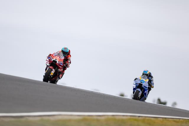 (261024) -- PHILLIP ISLAND, Oct. 24, 2026 (Xinhua) -- Ducati Lenovo Team's Marc Marquez (L) of Spain and BK8 Gresini Racing MotoGP's Alex Marquez of Spain compete during the sprint session of the MotoGP Australian Grand Prix 2026 at the Phillip Island Grand Prix Circuit in Phillip Island, Australia, Oct. 24, 2026. (Photo by Jin Cheng/Xinhua)