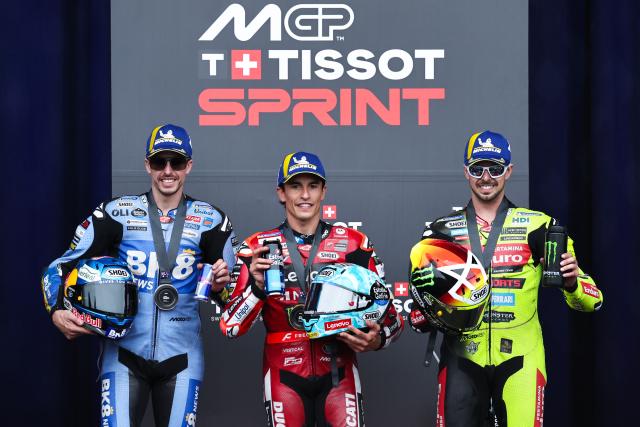 (261024) -- PHILLIP ISLAND, Oct. 24, 2026 (Xinhua) -- Winner Ducati Lenovo Team's Marc Marquez (C) of Spain, second place BK8 Gresini Racing MotoGP's Alex Marquez (L) of Spain and third place Pertamina Enduro VR46 Racing Team's Fabio Di Giannantonio of Italy pose for photos after the sprint session of the MotoGP Australian Grand Prix 2026 at the Phillip Island Grand Prix Circuit in Phillip Island, Australia, Oct. 24, 2026. (Photo by Shu Zelin/Xinhua)