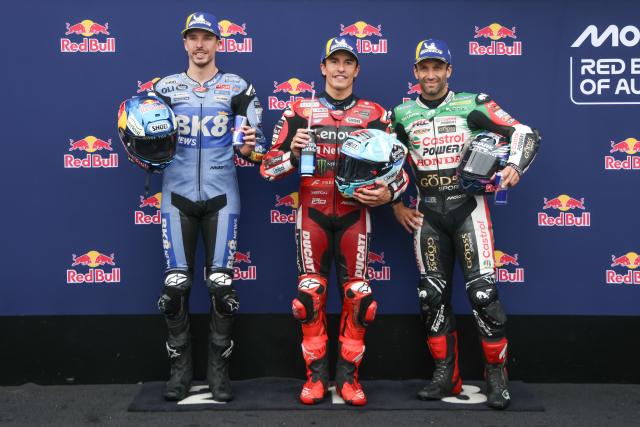 (261024) -- PHILLIP ISLAND, Oct. 24, 2026 (Xinhua) -- Pole Position sitter Ducati Lenovo's Marc Marquez (C) of Spain, second place BK8 Gresini Racing MotoGP's Alex Marquez (L) of Spain and third place Castrol Honda LCR's Johann Zarco of France pose for photos after the qualifying session of the MotoGP Australian Grand Prix 2026 at the Phillip Island Grand Prix Circuit in Phillip Island, Victoria, Australia, Oct. 24, 2026. (Photo by Jin Cheng/Xinhua)