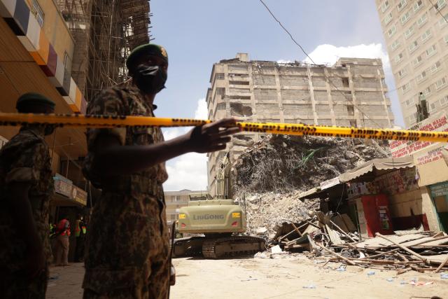 (261024) -- NAIROBI, Oct. 24, 2026 (Xinhua) -- National Youth Service officers secure the scene of a building collapse in Eastleigh, Nairobi, Kenya, Oct. 24, 2026. Kenyan authorities on Saturday continued to search for seven people still missing after a multi-story building collapsed in a suburb of Nairobi on Friday. (Photo by John Okoyo/Xinhua)