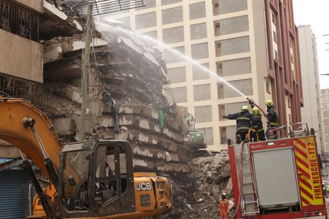 (261024) -- NAIROBI, Oct. 24, 2026 (Xinhua) -- Rescuers work at the site of a building collapse in Eastleigh, Nairobi, Kenya, Oct. 24, 2026. Kenyan authorities on Saturday continued to search for seven people still missing after a multi-story building collapsed in a suburb of Nairobi on Friday. (Photo by John Okoyo/Xinhua)
