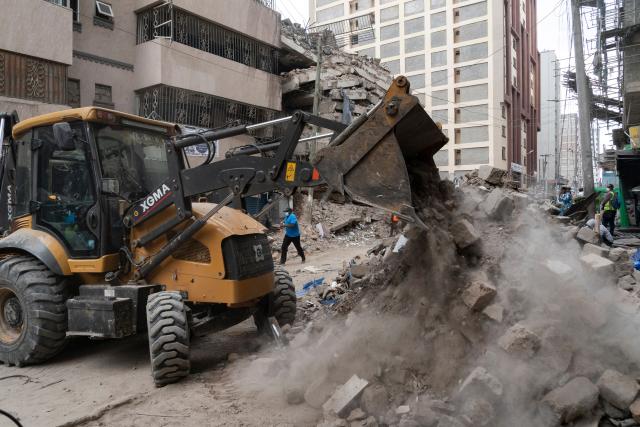 (261024) -- NAIROBI, Oct. 24, 2026 (Xinhua) -- Rescuers work at the site of a building collapse in Eastleigh, Nairobi, Kenya, Oct. 23, 2026. Kenyan authorities on Saturday continued to search for seven people still missing after a multi-story building collapsed in a suburb of Nairobi on Friday. (Xinhua/Xie Jianfei)