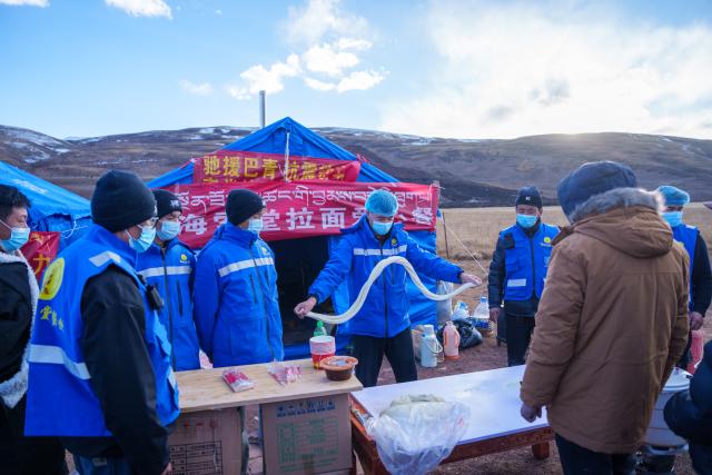 (261024) -- NAGQU, Oct. 24, 2026 (Xinhua) -- A volunteer makes noodles at a quake-hit village in Maru Township of Baqen County, Nagqu City, southwest China's Xizang Autonomous Region, Oct. 24, 2026. As of 11 a.m. Saturday, 52,450 items or sets of disaster relief supplies had been sent to the quake zone, while more than 2,500 rescue personnel were engaged in relief operations.
   Authorities have established 35 temporary resettlement sites in the disaster zone. Medical treatment and public health and epidemic prevention efforts are proceeding in an orderly manner, according to the local emergency command headquarters. (Xinhua/Tenzin Nyida)