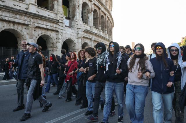 (261024) -- ROME, Oct. 24, 2026 (Xinhua) -- Demonstrators march past the Colosseum during an anti-war march in Rome, Italy, Oct. 24, 2026. Protests over rising living costs, military expansion and increased arms spending swept across several Italian cities on Saturday, with clashes between demonstrators and police reported in multiple locations.
In Rome, demonstrators set off from Piazza della Repubblica, according to the ANSA news agency. Clashes erupted between protesters and police in the city center later in the evening, prompting police to use water cannons and tear gas in an attempt to disperse the crowds. (Xinhua/Wang Kaiyan)