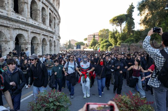 (261024) -- ROME, Oct. 24, 2026 (Xinhua) -- Demonstrators march past the Colosseum during an anti-war march in Rome, Italy, Oct. 24, 2026. Protests over rising living costs, military expansion and increased arms spending swept across several Italian cities on Saturday, with clashes between demonstrators and police reported in multiple locations.
In Rome, demonstrators set off from Piazza della Repubblica, according to the ANSA news agency. Clashes erupted between protesters and police in the city center later in the evening, prompting police to use water cannons and tear gas in an attempt to disperse the crowds. (Xinhua/Wang Kaiyan)