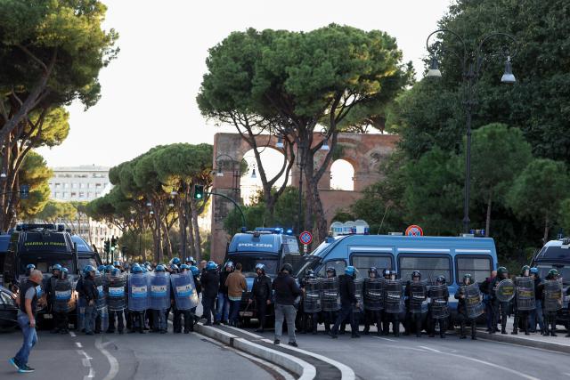 (261024) -- ROME, Oct. 24, 2026 (Xinhua) -- Police stand guard near Circo Massimo for an anti-war march in Rome, Italy, Oct. 24, 2026. Protests over rising living costs, military expansion and increased arms spending swept across several Italian cities on Saturday, with clashes between demonstrators and police reported in multiple locations.
In Rome, demonstrators set off from Piazza della Repubblica, according to the ANSA news agency. Clashes erupted between protesters and police in the city center later in the evening, prompting police to use water cannons and tear gas in an attempt to disperse the crowds. (Xinhua/Wang Kaiyan)