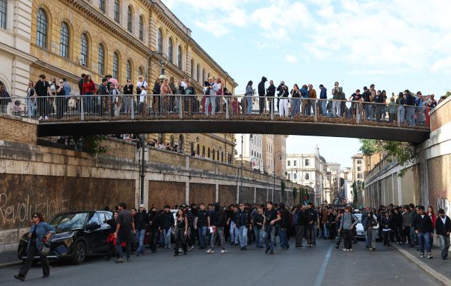 (261024) -- ROME, Oct. 24, 2026 (Xinhua) -- Demonstrators are seen during an anti-war march in Rome, Italy, Oct. 24, 2026. Protests over rising living costs, military expansion and increased arms spending swept across several Italian cities on Saturday, with clashes between demonstrators and police reported in multiple locations.
In Rome, demonstrators set off from Piazza della Repubblica, according to the ANSA news agency. Clashes erupted between protesters and police in the city center later in the evening, prompting police to use water cannons and tear gas in an attempt to disperse the crowds. (Xinhua/Wang Kaiyan)