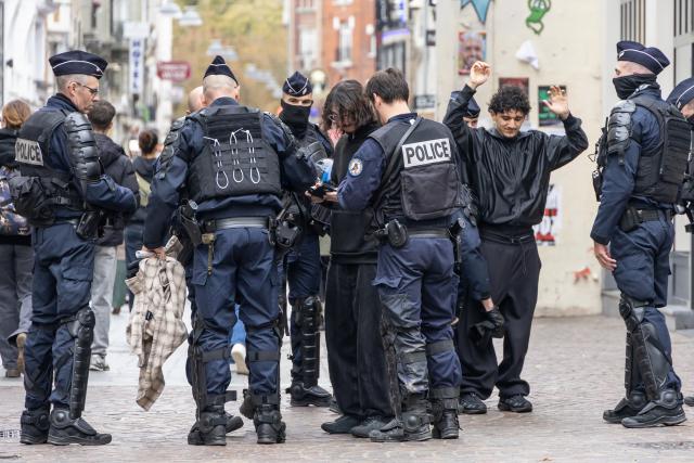 (261024) -- LILLE, Oct. 24, 2026 (Xinhua) -- Security personnel work on the street in Lille, France, Oct. 24, 2026. Around 410,000 people took part in a new round of protests across France on Saturday, French news channel BFM TV reported, citing the Interior Ministry. (Photo by Sebastien Courdji/Xinhua)