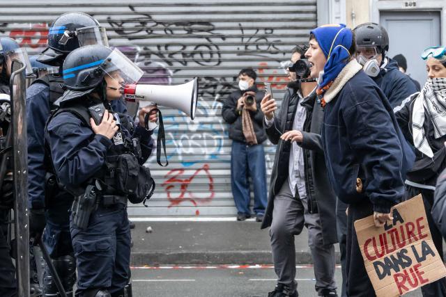 (261024) -- LILLE, Oct. 24, 2026 (Xinhua) -- Protesters confront with security personnel in Lille, France, Oct. 24, 2026. Around 410,000 people took part in a new round of protests across France on Saturday, French news channel BFM TV reported, citing the Interior Ministry. (Photo by Sebastien Courdji/Xinhua)