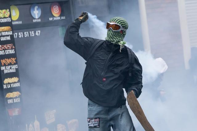 (261024) -- LILLE, Oct. 24, 2026 (Xinhua) -- A protester is seen in Lille, France, Oct. 24, 2026. Around 410,000 people took part in a new round of protests across France on Saturday, French news channel BFM TV reported, citing the Interior Ministry. (Photo by Sebastien Courdji/Xinhua)