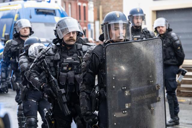(261024) -- LILLE, Oct. 24, 2026 (Xinhua) -- Security personnel work on the street in Lille, France, Oct. 24, 2026. Around 410,000 people took part in a new round of protests across France on Saturday, French news channel BFM TV reported, citing the Interior Ministry. (Photo by Sebastien Courdji/Xinhua)