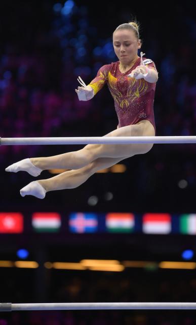 (261025) -- ROTTERDAM, Oct. 25, 2026 (Xinhua) -- World Gymnastics 2 athlete Glotova Alena from Russia competes during the women's uneven bars final at the Artistic Gymnastics World Championships 2026 in Rotterdam, the Netherlands, Oct. 24, 2026. (Xinhua/Weng Xinyang)