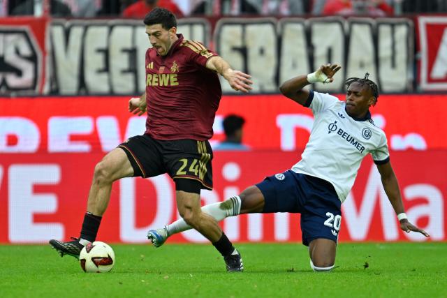 (261025) -- COLOGNE, Oct. 25, 2026 (Xinhua) -- Luca Lochoshvili (L) of FC Cologne vies with Junior Adamu of FC Schalke 04 during the German first division Bundesliga football match between FC Cologne and FC Schalke 04 in Cologne, Germany, Oct. 24, 2026. (Photo by Ulrich Hufnagel/Xinhua)
