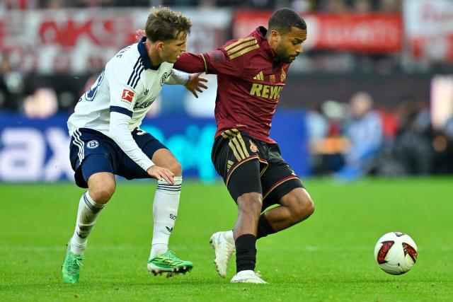 (261025) -- COLOGNE, Oct. 25, 2026 (Xinhua) -- Linton Maina (R) of FC Cologne vies with Vitalie Becker of FC Schalke 04 during the German first division Bundesliga football match between FC Cologne and FC Schalke 04 in Cologne, Germany, Oct. 24, 2026. (Photo by Ulrich Hufnagel/Xinhua)