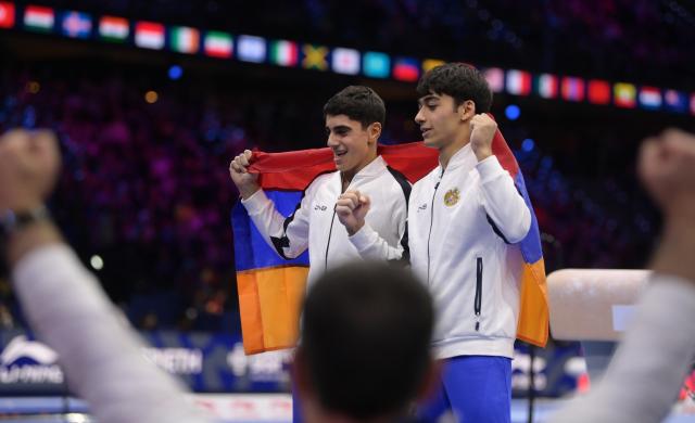 (261025) -- ROTTERDAM, Oct. 25, 2026 (Xinhua) -- Hamlet Manukyan (L) and Mamikon Khachatryan of Armenia celebrate during the men's pommel horse final at the Artistic Gymnastics World Championships 2026 in Rotterdam, the Netherlands, Oct. 24, 2026. (Xinhua/Weng Xinyang)