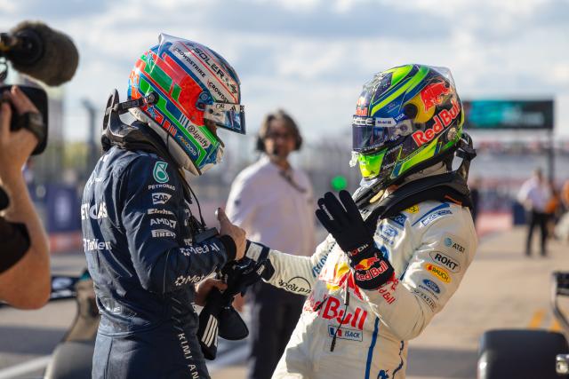 (261025) -- AUSTIN, Oct. 25, 2026 (Xinhua) -- Mercedes' Kimi Antonelli (L) of Italy receives congratulations from Red Bull Racing's Isack Hadjar of France after the qualifying session of the Formula One United States Grand Prix, in Austin, Texas, the United States, Oct. 24, 2026. (Photo by Song Haiyuan/Xinhua)