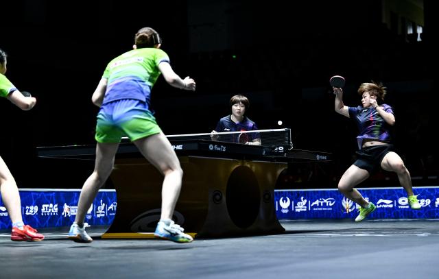 (261025) -- TASHKENT, Oct. 25, 2026 (Xinhua) -- Kuai Man/Wang Yidi (R) of China compete during the women's doubles final against Harimoto Miwa/Hayata Hina of Japan at the 29th ITTF-Asian Table Tennis Championships in Tashkent, Uzbekistan, Oct. 25, 2026. (Xinhua/Feng Kaihua)