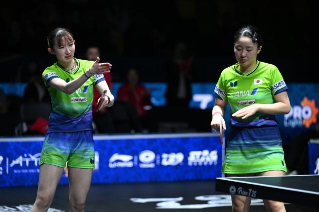 (261025) -- TASHKENT, Oct. 25, 2026 (Xinhua) -- Harimoto Miwa/Hayata Hina (L) of Japan react during the women's doubles final against Kuai Man/Wang Yidi of China at the 29th ITTF-Asian Table Tennis Championships in Tashkent, Uzbekistan, Oct. 25, 2026. (Xinhua/Feng Kaihua)