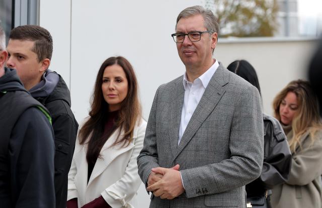 (261025) -- BELGRADE, Oct. 25, 2026 (Xinhua) -- Former Serbian President Aleksandar Vucic and his wife Tamara Vucic wait in line to cast their ballots for the early parliamentary election at a polling station in Belgrade, Serbia, on Oct. 25, 2026. Polling stations opened across Serbia at 7 a.m. local time (0600 GMT) on Sunday in snap parliamentary elections to elect the country's 250-seat National Assembly. (Photo by Predrag Milosavljevic/Xinhua)
