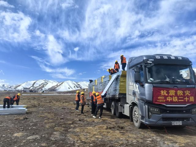 (261025) -- BAQEN, Oct. 25, 2026 (Xinhua) -- Rescuers from the China Railway 20th Bureau Group Corporation Limited build prefabricated houses at a quake-hit village in Gangchen Township of Baqen County, Nagqu City, southwest China's Xizang Autonomous Region, Oct. 25, 2026. Rescue and relief efforts continue after a 7.0-magnitude earthquake struck Baqen County of the city of Nagqu in southwest China's Xizang Autonomous Region, local authorities said Saturday.
The roof panels of the first batch of prefabricated houses have been installed in Sunday afternoon in the quake-hit village in Gangchen Township of Baqen, and the laying of cables and the installation of doors and windows have been advanced successively. Currently, seven prefabricated houses have been basically completed. (Xinhua)