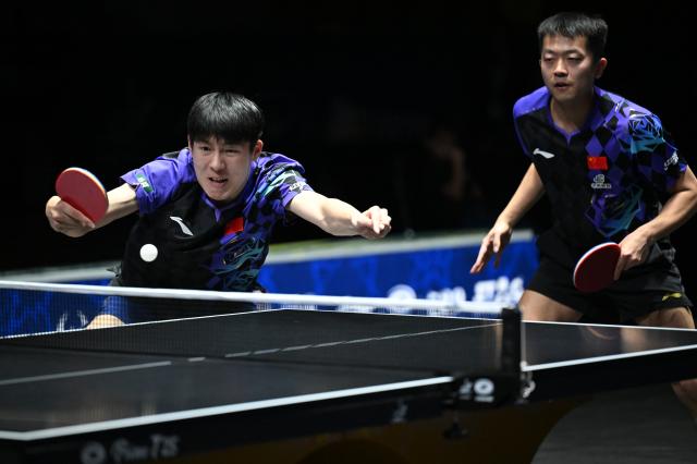 (261025) -- TASHKENT, Oct. 25, 2026 (Xinhua) -- Wen Ruibo (L)/Yuan Licen of China compete during the men's doubles final against Lin Shidong/Huang Youzheng of China at the 29th ITTF-Asian Table Tennis Championships in Tashkent, Uzbekistan, Oct. 25, 2026. (Xinhua/Feng Kaihua)