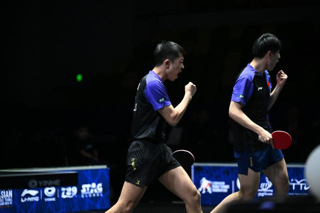 (261025) -- TASHKENT, Oct. 25, 2026 (Xinhua) -- Wen Ruibo/Yuan Licen (L) of China celebrate during the men's doubles final against Lin Shidong/Huang Youzheng of China at the 29th ITTF-Asian Table Tennis Championships in Tashkent, Uzbekistan, Oct. 25, 2026. (Xinhua/Feng Kaihua)