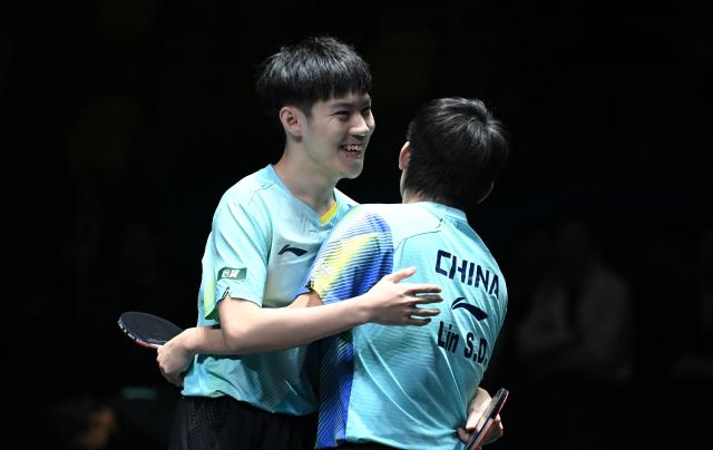 (261025) -- TASHKENT, Oct. 25, 2026 (Xinhua) -- Lin Shidong/Huang Youzheng (L) of China celebrate after the men's doubles final against Wen Ruibo/Yuan Licen of China at the 29th ITTF-Asian Table Tennis Championships in Tashkent, Uzbekistan, Oct. 25, 2026. (Xinhua/Feng Kaihua)
