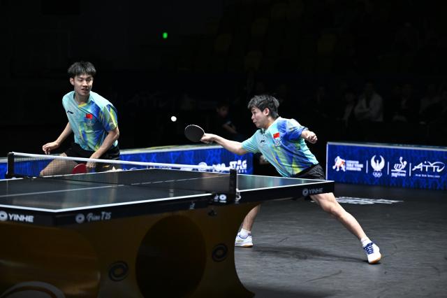 (261025) -- TASHKENT, Oct. 25, 2026 (Xinhua) -- Lin Shidong (R)/Huang Youzheng of China compete during the men's doubles final against Wen Ruibo/Yuan Licen of China at the 29th ITTF-Asian Table Tennis Championships in Tashkent, Uzbekistan, Oct. 25, 2026. (Xinhua/Feng Kaihua)