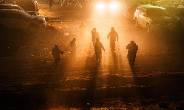 (261025) -- BAQEN, Oct. 25, 2026 (Xinhua) -- People holding dumplings and rescuers who have finished eating walk back to a temporary shelter in Maru Township of Baqen County, Nagqu City, southwest China's Xizang Autonomous Region, Oct. 24, 2026. After a 7.0-magnitude earthquake struck Baqen County in Nagqu, southwest China's Xizang Autonomous Region, on Thursday, Du Guoping, owner of a dumpling restaurant in Xigaze, postponed the opening of his two new restaurants and headed to the disaster zone with his staff.
  "It took only about 10 minutes to make the decision that we would go to Baqen and cook dumplings for earthquake-affected residents," Du said.
  The team loaded more than 1,500 kilograms of dumplings onto vehicles and set off from Xigaze at midnight on the night of the earthquake. 
  Upon arrival, Du and his staff set up cooking equipment and prepared dumplings for rescue workers and affected residents.
"Make sure everyone gets enough dumplings, and give children a couple more," Du kept telling his staff.
  Du and his staff did not eat any of the dumplings themselves. After a full day of cooking, they had some instant noodles -- their only meal of the day. At night, the six team members of Du squeezed into two vehicles to rest.
  "We will cook all the dumplings we brought," Du said. "We feel honored to be able to contribute in our own way." (Xinhua/Tenzin Nyida)
