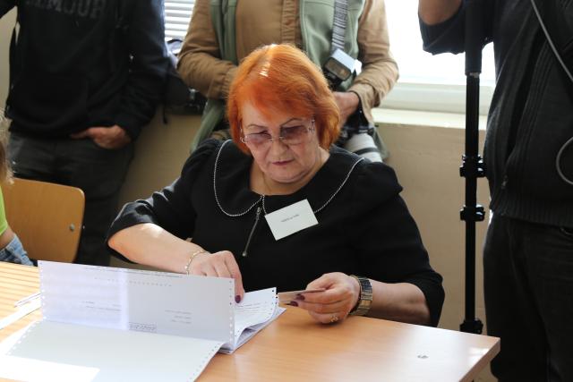(261025) -- SOFIA, Oct. 25, 2026 (Xinhua) -- A staff member checks information during the presidential election at a polling station in Sofia, Bulgaria, Oct. 25, 2026. Bulgarians went to the polls on Sunday to elect their next president.
  As many as 6.59 million voters are eligible to choose from 27 candidates, including incumbent President Iliana Iotova, according to the country's Central Election Commission.
  Polling stations across the country opened at 7:00 a.m. local time (0500 GMT) and are scheduled to close at 8:00 p.m.
  The first exit polls may be released immediately after voting ends, while the official results must be announced no later than Tuesday evening. (Xinhua/Lin Hao)