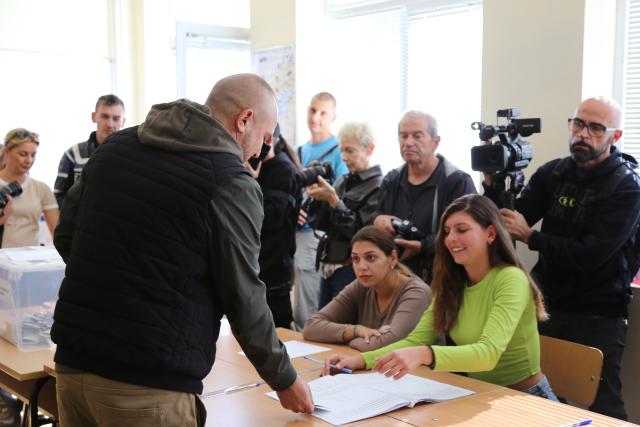 (261025) -- SOFIA, Oct. 25, 2026 (Xinhua) -- A Bulgarian citizen registers for voting during the presidential election at a polling station in Sofia, Bulgaria, Oct. 25, 2026. Bulgarians went to the polls on Sunday to elect their next president.
  As many as 6.59 million voters are eligible to choose from 27 candidates, including incumbent President Iliana Iotova, according to the country's Central Election Commission.
  Polling stations across the country opened at 7:00 a.m. local time (0500 GMT) and are scheduled to close at 8:00 p.m.
  The first exit polls may be released immediately after voting ends, while the official results must be announced no later than Tuesday evening. (Xinhua/Lin Hao)