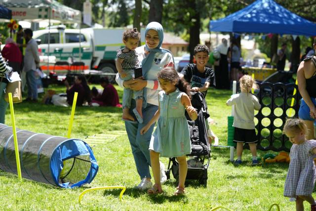 (261025) -- QUEANBEYAN, Oct. 25, 2026 (Xinhua) -- Children enjoy amusement activities during an event to celebrate Children's Week 2026 in New South Wales, Australia, on Oct. 24, 2026. Hundreds of children and their families gathered at Queanbeyan Park, near Australia's capital Canberra, on Saturday to celebrate Children's Week 2026. The event featured a range of activities for children and families, bringing the local community together to enjoy a day of fun and celebration. (Photo by Zhang Na/Xinhua)
