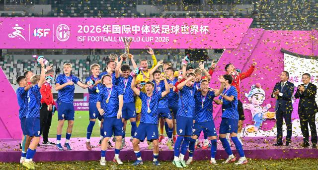 (261025) -- SUZHOU, Oct. 25, 2026 (Xinhua) -- Men's group winner members of Croatia celebrate during the awarding ceremony at the 2026 International School Sport Federation (ISF) Football World Cup in Suzhou, east China's Jiangsu Province, Oct. 25, 2026. (Photo by Yang Suping/Xinhua)